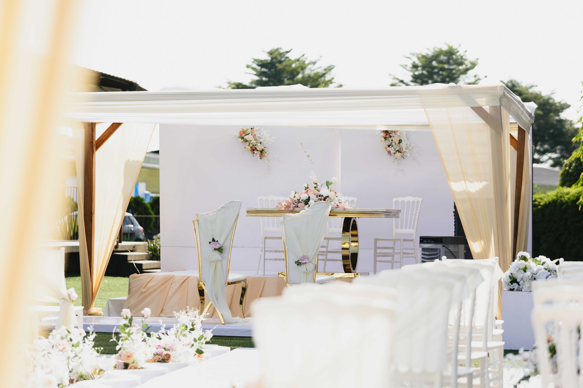 elegant outdoor wedding ceremony setup with floral decor